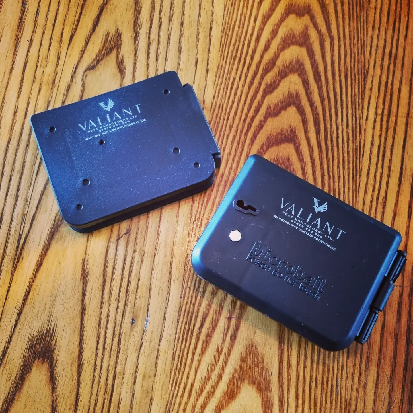 Two Valiant-branded bait boxes
