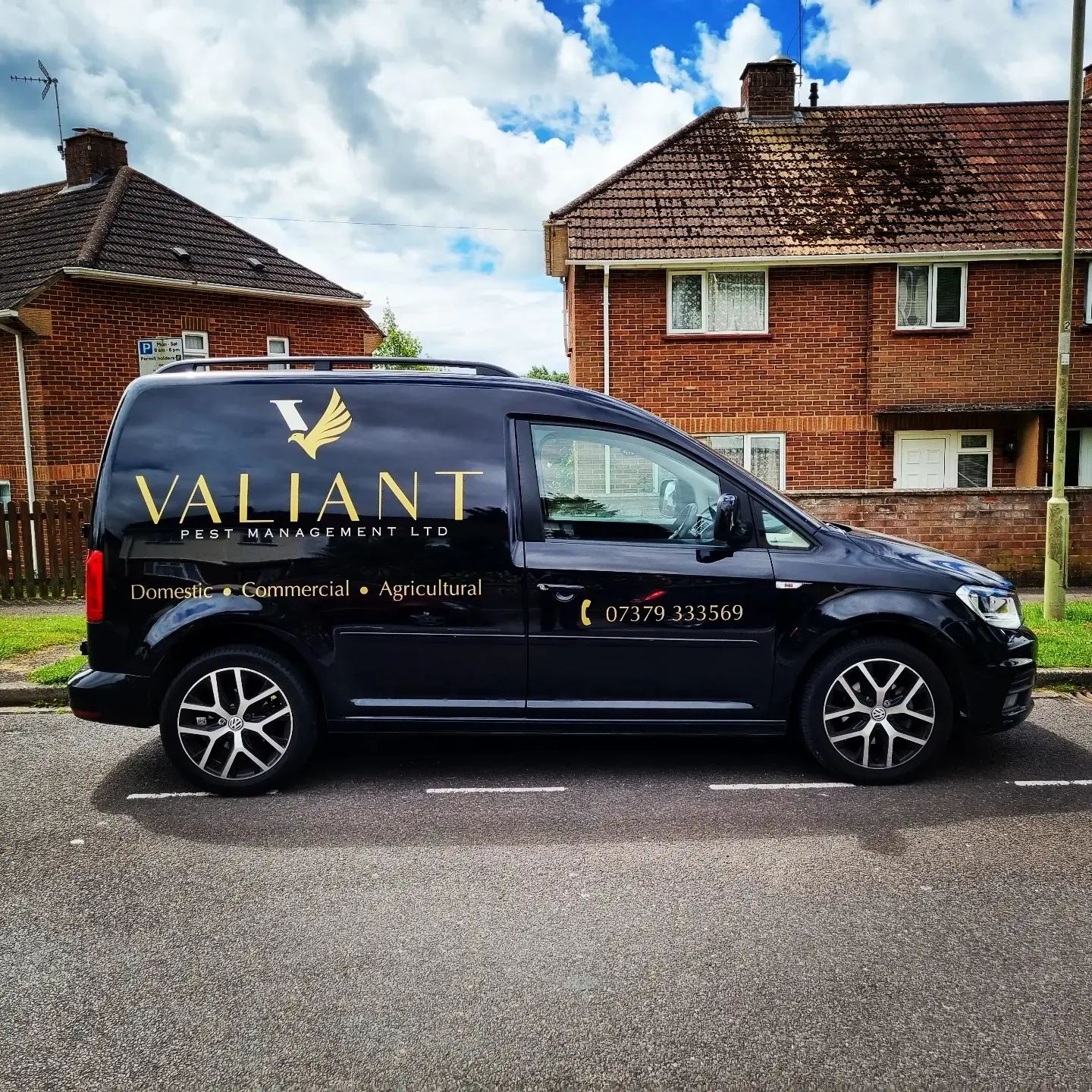 The black Valiant Pest Management van in gold livery: Domestic, Commercial, Agricultural